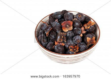 Dried Diospyros lotus or Wild Persimmon on white background. Selective focus.