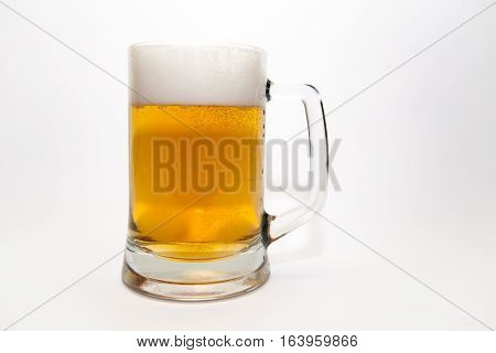 Mug foamy beer on a white background