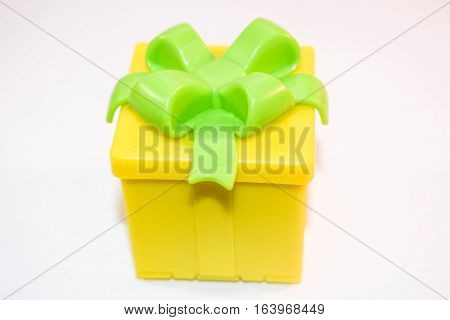 festive yellow box with a bright green bow on top