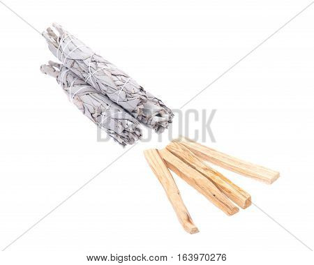 Sage and palo santo smudging sticks isolated on white background