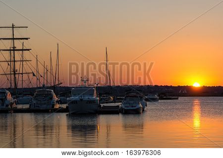 Sozopol, Bulgaria - July 11, 2016: Sunset at the port of Sozopol, Burgas Region, Bulgaria