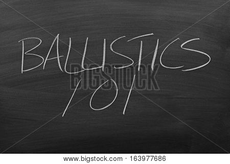 The words "Ballistics 101" on a blackboard in chalk