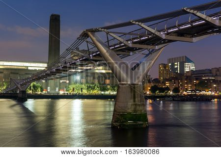 LONDON, ENGLAND - JUNE 17 2016: Night Panorama of Millennium Bridge, Tate Modern Gallery and Thames River, London, United Kingdom