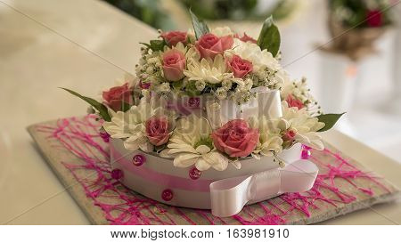 Beautiful cake made from a variety of colorful flowers