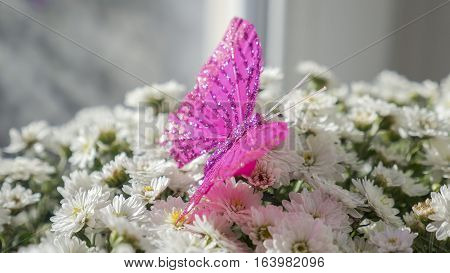 The butterfly is sitting on a bouquet of white flowers