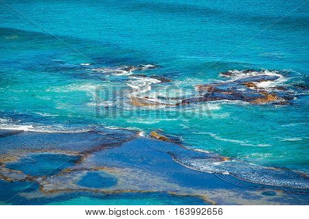 Quiet waves on rocks and rock pools