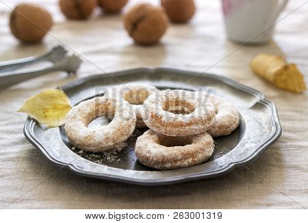 Sand Dough Biscuits, Coffee And Walnuts On A Linen Tablecloth. Rustic Style.