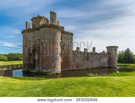 Shearington, Scotland, Uk - June 18, 2012: Entrance And West Side Of Ruined  Triangular Brown Stone 