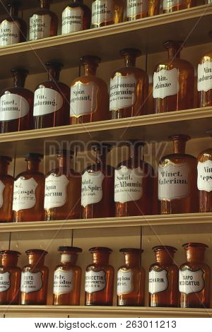Enkhuizen, The Netherlands - October 12th 2018: Vintage Glass Bottles In A Reconstructed 19th Centur