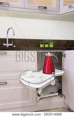 Kitchen corner storage unit with pullout shelves for cookware.