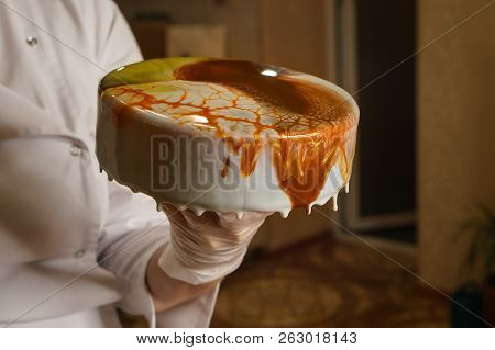 Mousse Esterhazy Cake. Girl Creates Drawing Of Mousse On Cake. Frozen Glass Icing On Cake. Culinary 