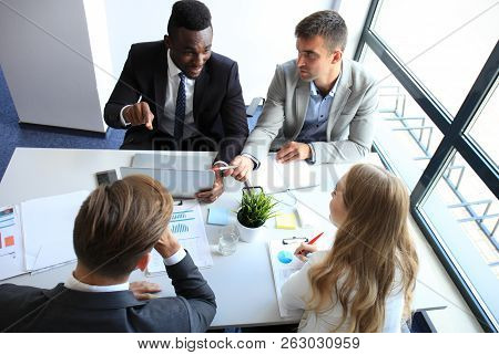 Top View Of Business People Working Together While Spending Time In The Office.