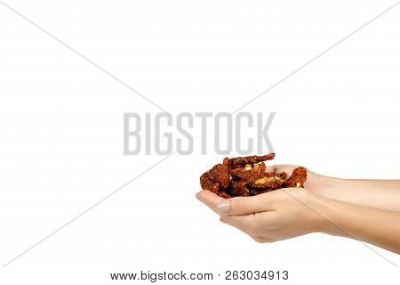 Sun Dried Red Tomatoes With Hand Isolated On White Background, Copy Space Template