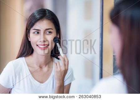 Asian Lady Makeup Bewore Go Out To Working With Mirror In Bed Room, This Immage Canuse For Makeup, W