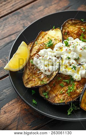 Healthy Vegeterain Oven Baked Aubergines, Eggplant With Cottage Cheese Dip, Parsley And Lemon Wedge.