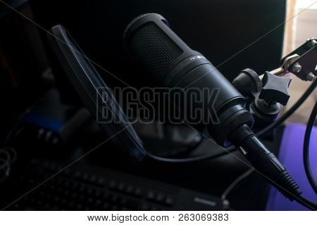 Closeup Black Microphone In Home Recording Studio With Pop Shield On Mic Stand