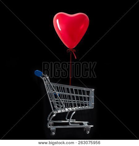 Balloon Heart Shaped  Over Of The Shopping Cart Against The Blac