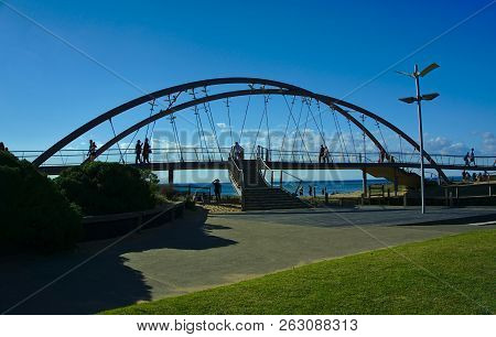 Frankston, Vic / Australia - Oct 13 2018: Bridge On The Beach On Sunny Day With Plain Blue Sky Backg