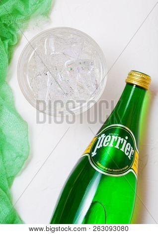 London, Uk - October 10, 2018 : Bottle Of Perrier Sparkling Water With Glass And Green Cloth. Perrie