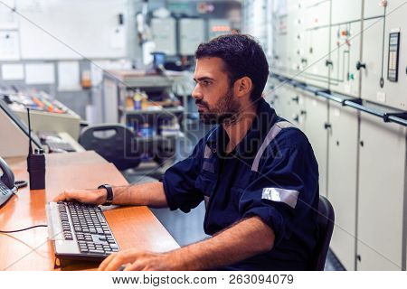 Marine Engineer Officer Working In Engine Room