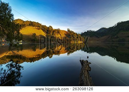 Beautiful Nature Landscape By The Lakeside Will Full Reflection In The Morning.ranu Kumbolo Lake, Se