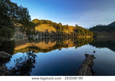 Beautiful Nature Landscape By The Lakeside Will Full Reflection In The Morning.ranu Kumbolo Lake, Se