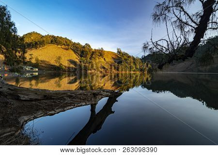 Beautiful Nature Landscape By The Lakeside Will Full Reflection In The Morning.ranu Kumbolo Lake, Se