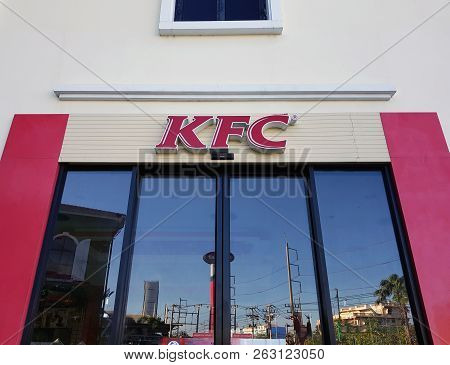 7 October 2018 Pathumthani Thailand: Kfc Fast Food Restaurant Logo On Front Window Wall. Kentucky Fr