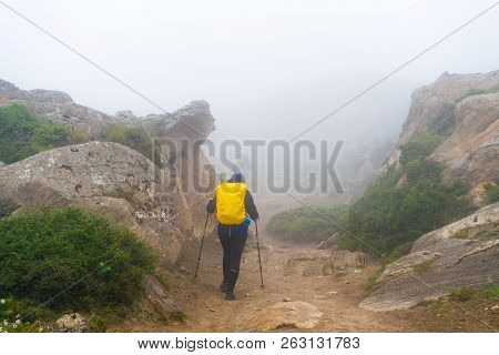 Backpackers On Foggy Trekking Path In Annapurna Conservation Area, Nepal