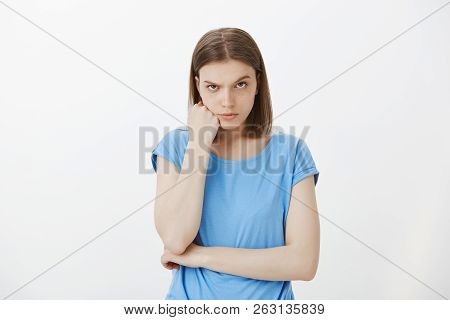 Woman Is Mad Boyfriend Trying Make Her Look Stupid. Pissed Angry Girlfriend In Blue T-shirt, Frownin