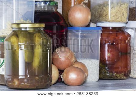 Storage Shelves In Pantry With Homemade Canned Preserved Fruits And Vegetables