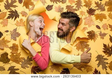 Autumn Couple Wearing In Autumn Clothes And Looks Very Sensually. Surprised Couple On Autumn Clothes