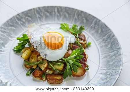 Breakfats With Fried Egg, Potato And Garlic Sprouts