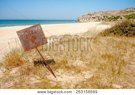 Rusty Blank Metal Bunner On Desert Sandy Coast Near Sea, Crymea, Russia