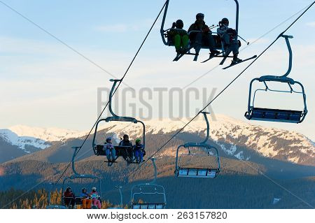 Bukovel, Ukraine - Dec 08, 2015: People On A Ski Lift In Bukovel. Bukovel Is The Most Popular Ski Re