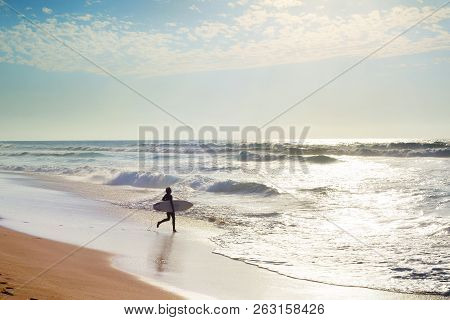 Surfing In The Atlanctic Ocean. Algarve, Portugal