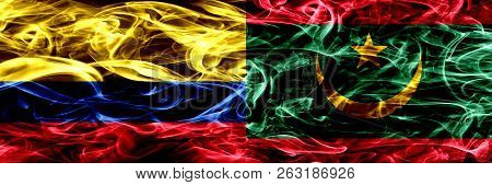 Colombia Vs Mauritania, Mauritanian Smoke Flags Placed Side By Side. Thick Colored Silky Smoke Flags