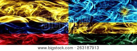 Colombia Vs Rwanda, Rwandan Smoke Flags Placed Side By Side. Thick Colored Silky Smoke Flags Of Colo