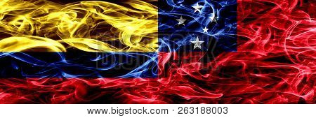 Colombia Vs Samoa, Samoan Smoke Flags Placed Side By Side. Thick Colored Silky Smoke Flags Of Colomb