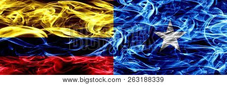 Colombia Vs Somalia, Somalian Smoke Flags Placed Side By Side. Thick Colored Silky Smoke Flags Of Co