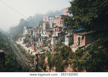 India, Haridwar. January 9, 2018. Houses On A Slope Near A Dirty Dump In A Filthy Indian Ghetto.