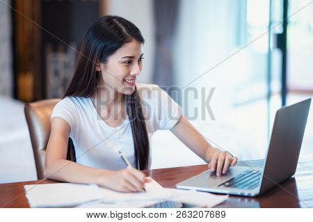 Asian Student Study And Do Home Work In Bed Room, This Immage Can Use For Education, Working, Office