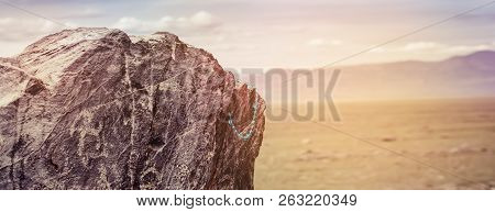 Tarkhatinsky Megalithic Complex Fragment. Ancient Petroglyphs Altai Russia. Toning Sunset.
