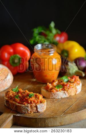 Homemade Vegetable Salad And Slice Of Bread On Wooden Table
