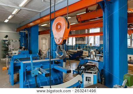 Crane Hook. The System Of Pulleys And Ropes, A Hanging Mechanism In The Production Area. Movement Re