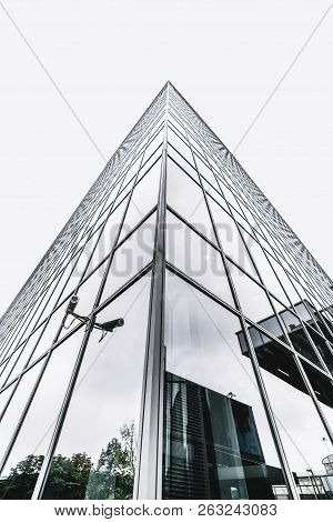 The Corner Of A Modern Business Skyscraper With Security Video Camera On The Side; A Contemporary Of