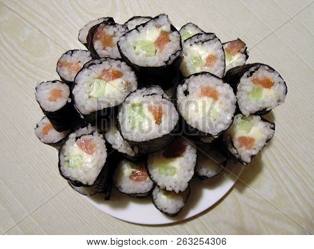 Sushi Rolls Homemade. Plate Lined With Rolls According To Japanese Recipes.