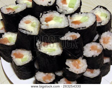 Sushi Rolls Homemade. Plate Lined With Rolls According To Japanese Recipes.