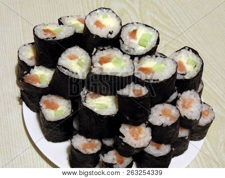 Sushi Rolls Homemade. Plate Lined With Rolls According To Japanese Recipes.