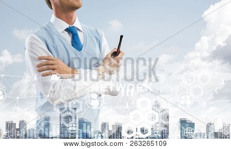 Double Exposure Of Confident And Young Businessman In Smart-casual Wear Smoking Pipe And Modern City